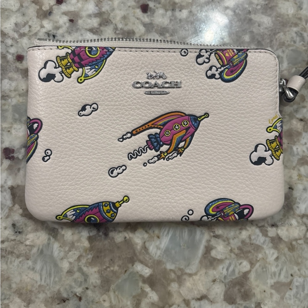 Coach Cream Wristlet with Colorful Rocket Print